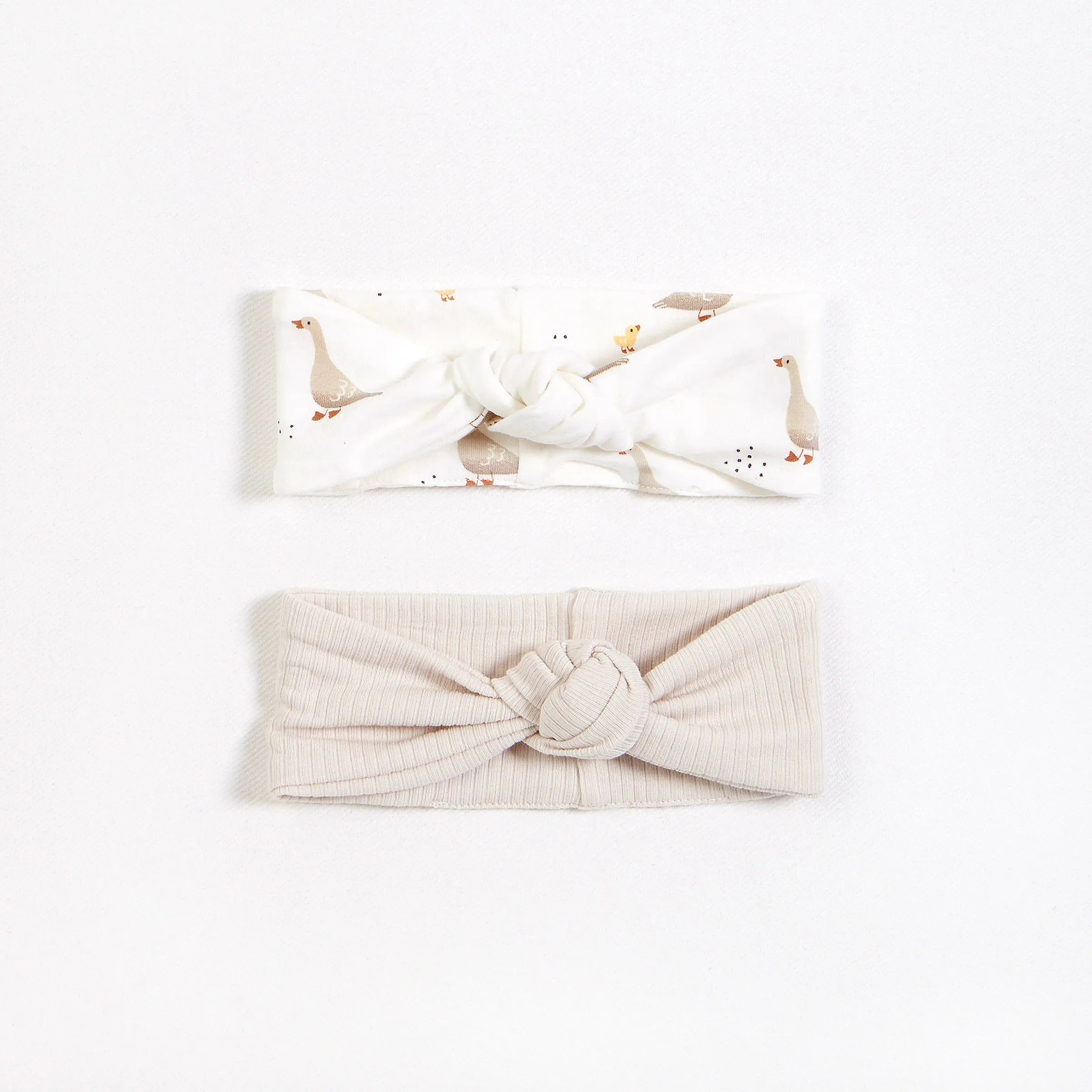 Petit Lem Baby 2 Pack Headbands In Colour Crème And Mother Goose Print Size NB to 24m